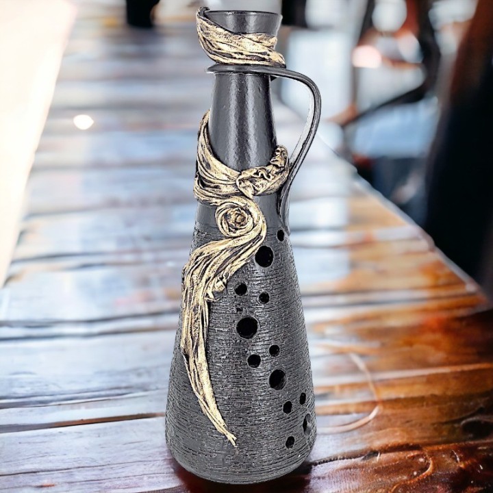 Black vase with fabric application