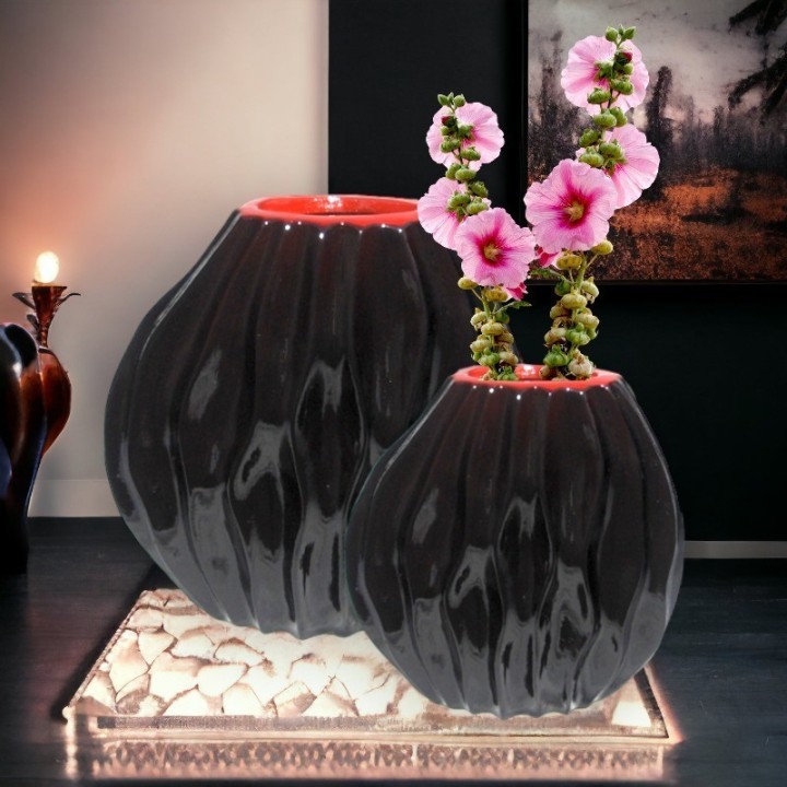 2 round maroon vases