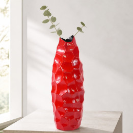 Red diamond vase with eucalyptus on pedestal