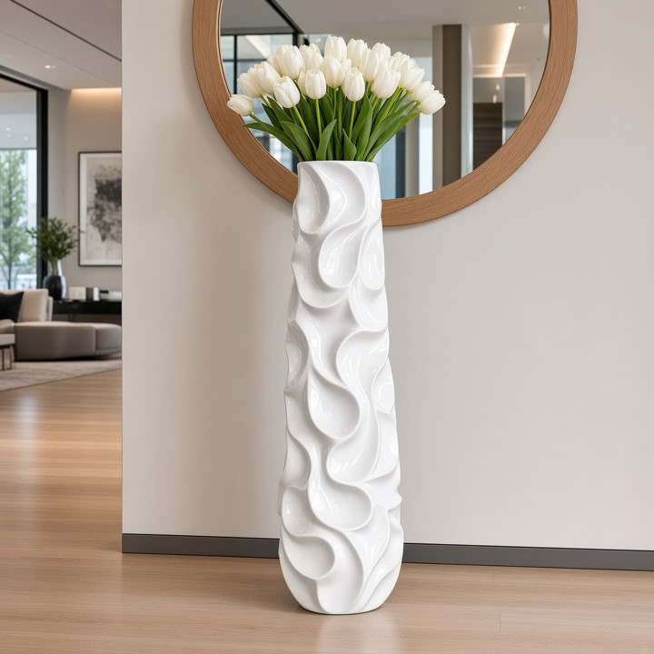 Tall glazed white ceramic vase with tulips front view