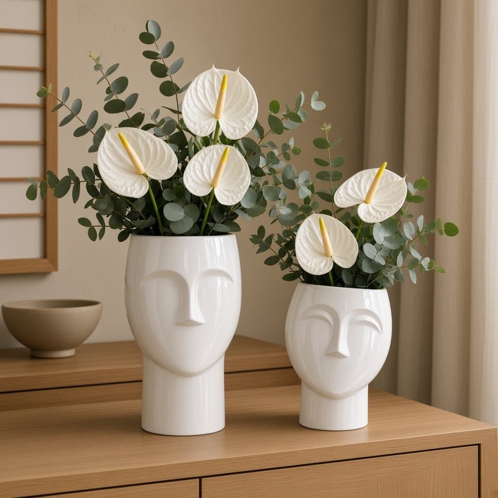 Pair of human head vases white glaze front view