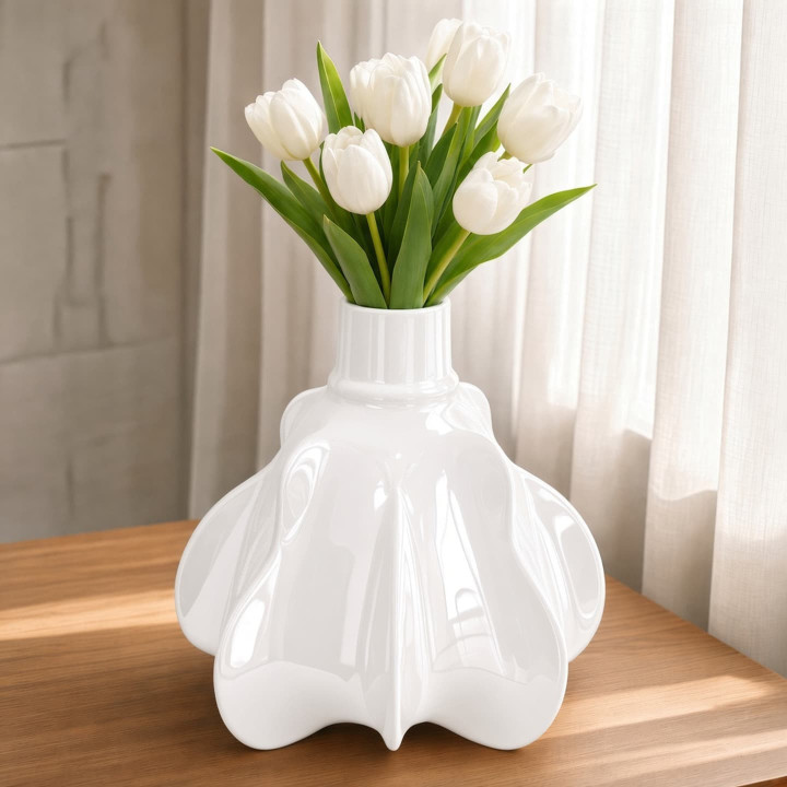 White ceramic pumpkin vase with tulips front view