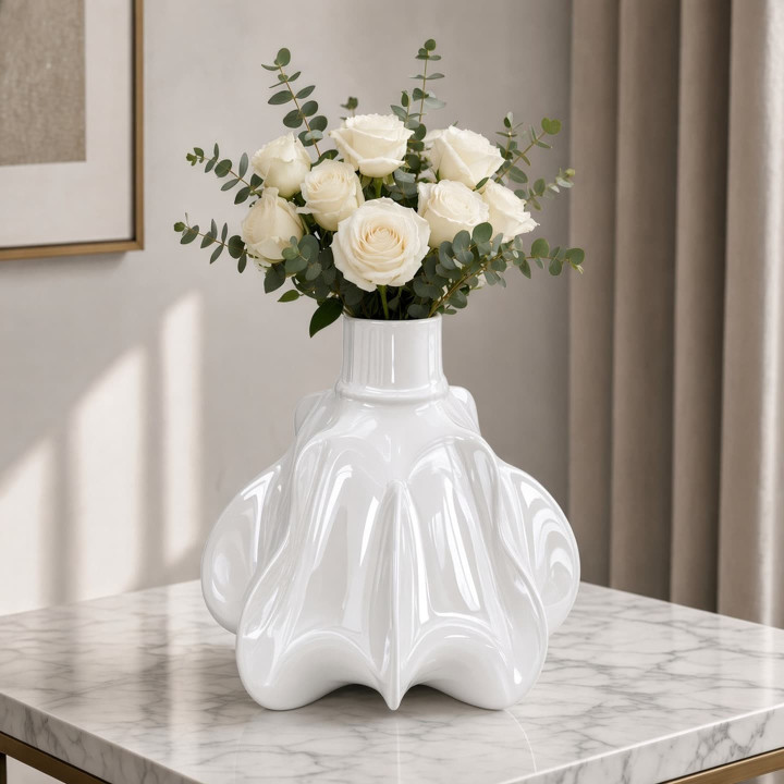 White ceramic pumpkin vase with flowers front view