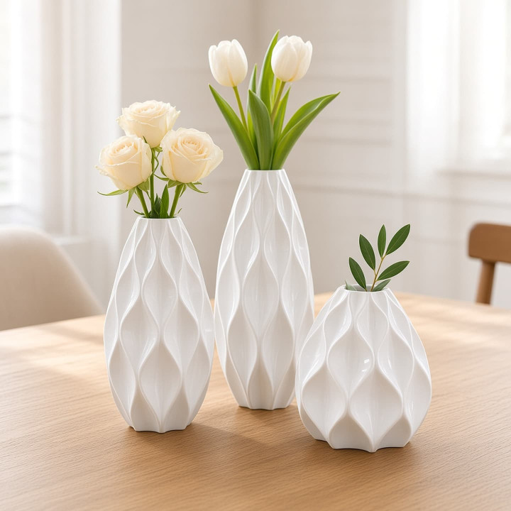 Trio white ceramic decorative vases relief front view
