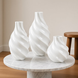 Set of twisted glossy white ceramic vases