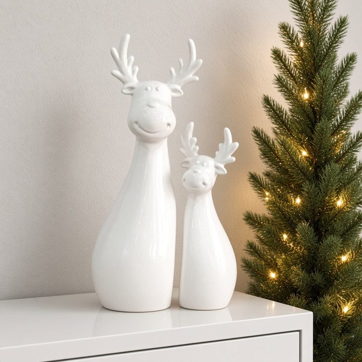 Coppia di renne natalizie in ceramica smaltata bianca