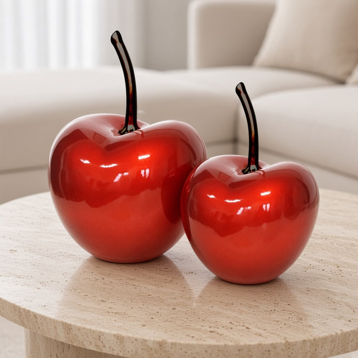 Two red decorative ceramic cherries with removable stem